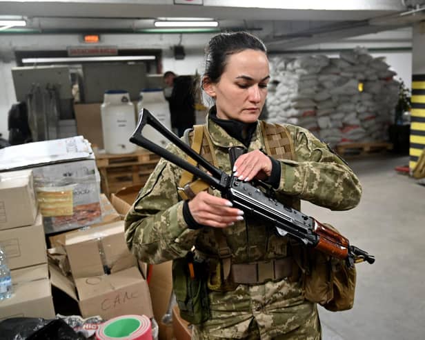 Iryna Sergeyeva, a volunteer, attends military training in an underground garage in Kyiv in March last year (Picture: Sergei Supinsky/AFP via Getty Images)