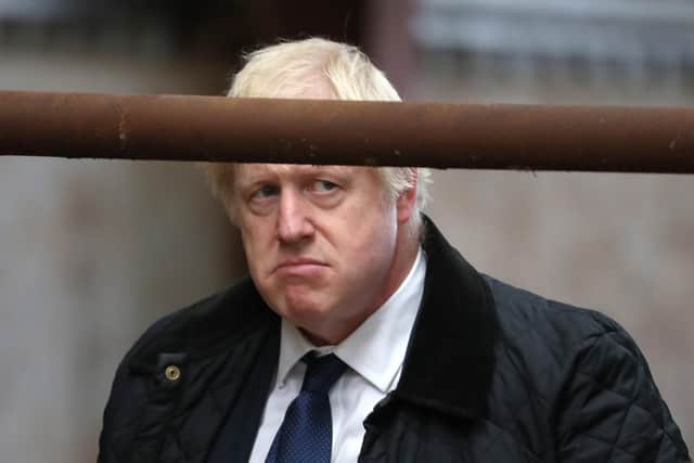 Boris Johnson, seen visiting a farm near Banchory, has been damaging support for the Scottish Conservatives for years (Picture: Andrew Milligan/WPA pool/Getty Images)