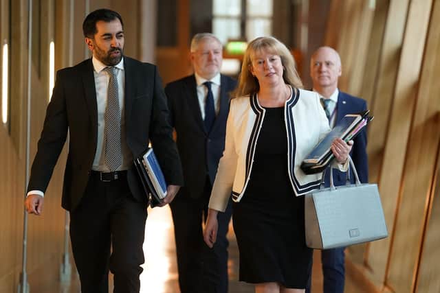 Deputy First Minister Shona Robison and Humza Yousaf make their way to the Scottish Parliament chamber ahead of her draft Budget statement (Picture: Andrew Milligan/PA)
