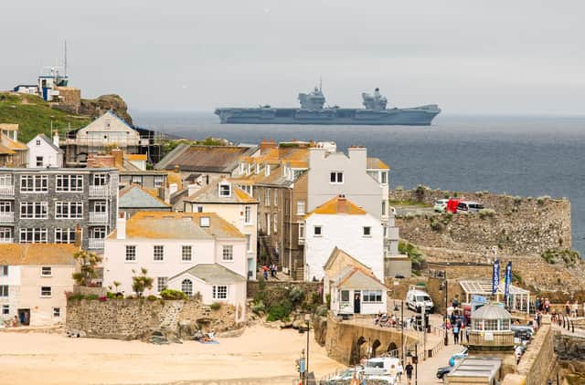 Joe Biden and Boris Johnson have already arrived  in Cornwall for a series of meetings ahead of the G7 summit, which officially starts today (Friday). HMS Prince of Wales patrols waters off St Ives as security remains at its highest level. PIC: SWNS.