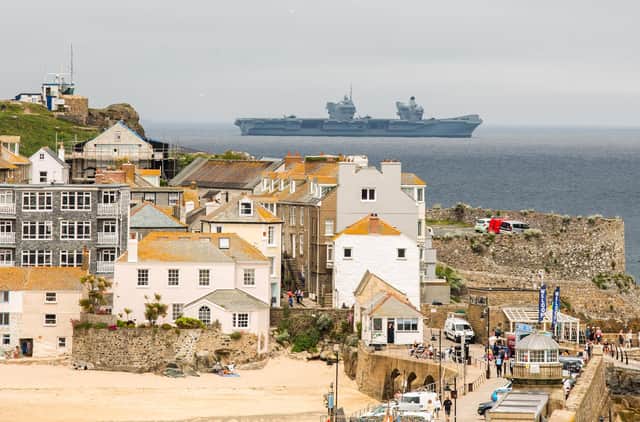 Joe Biden and Boris Johnson have already arrived in Cornwall for a series of meetings ahead of the G7 summit, which officially starts today (Friday). HMS Prince of Wales patrols waters off St Ives as security remains at its highest level. PIC: SWNS.