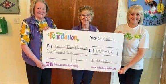 Fiona Cumming presents cheque to The Living Well Project Dementia Cafe