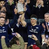 Scotland's Co-Captains Finn Russell, left, and Rory Darge, right, lift the Calcutta Cup after the win over England.
