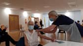 Emily Lawson, 101, being vaccinated against Covid-19.