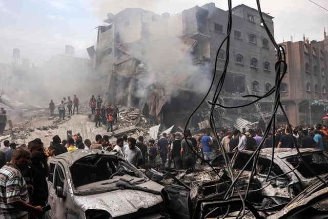 Palestinians search for survivors after an Israeli airstrike on buildings in the refugee camp of Jabalia in the Gaza Strip (Photo by MOHAMMED ABED/AFP via Getty Images)