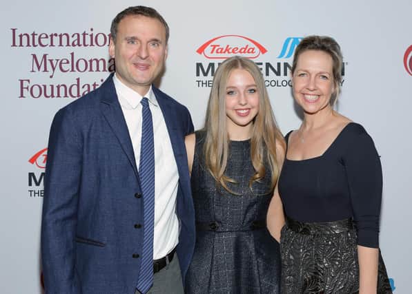 IMF Honorary Committee members Phil Rosenthal (L) and Monica Rosenthal (R) and Lily Rosenthal attend the International Myeloma Foundation's 7th Annual Comedy Celebration Benefiting The Peter Boyle Research Fund hosted by Ray Romano at The Wilshire Ebell Theatre on November 9, 2013 in Los Angeles, California. (Photo by Mike Windle/Getty Images for IMF)
