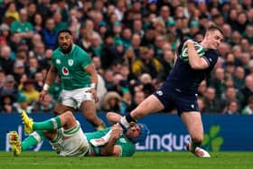 Scotland's Stafford McDowall on the attack, as Ireland's Tadhg Beirne tries to tackle him, with Bundee Aki in the background.  (Picture: Brian Lawless/PA Wire)