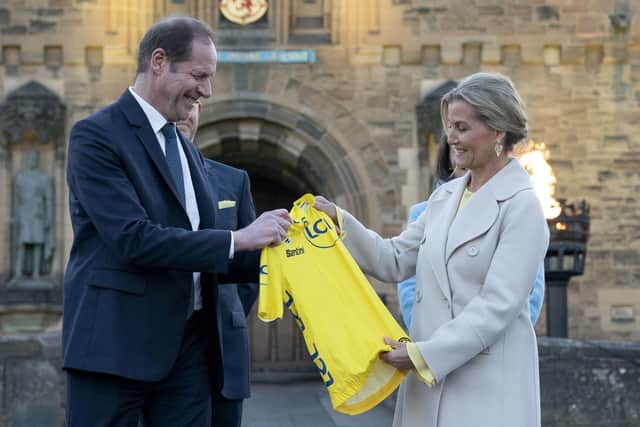 Race Director Christian Prudhomme presents The Duchess of Edinburgh with a yellow jersey at the 2027 Tour de France launch event, at Edinburgh Castle