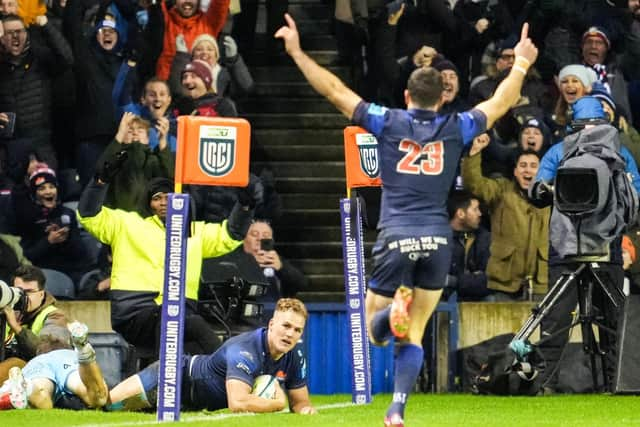 Emiliano Boffelli (no.23) celebrates as Edinburgh's Duhan van der Merwe scores what turns out to be the match-winning try against Glasgow Warriors at Murrayfield. (Photo by Simon Wootton / SNS Group)