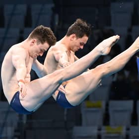 Why do Olympic divers wear tape and shower? Why are some scores crossed out in diving at the Tokyo Olympic Games 2020? (Image by Attila Kisbenedek/AFP via Getty Images)
