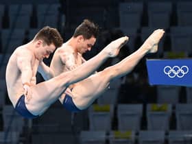 Why do Olympic divers wear tape and shower? Why are some scores crossed out in diving at the Tokyo Olympic Games 2020? (Image by Attila Kisbenedek/AFP via Getty Images)