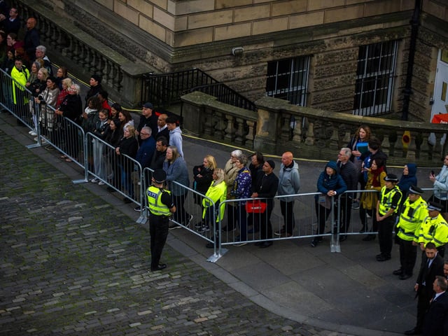 Mourners continue to file slowly past - with 4,000 people an hour expected to file through St GIles'