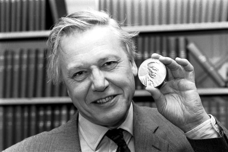 British journalist and broadcaster Sir David Attenborough with the Livingstone medal he received at a Royal Geographical Society lecture in Edinburgh, March 1990.
