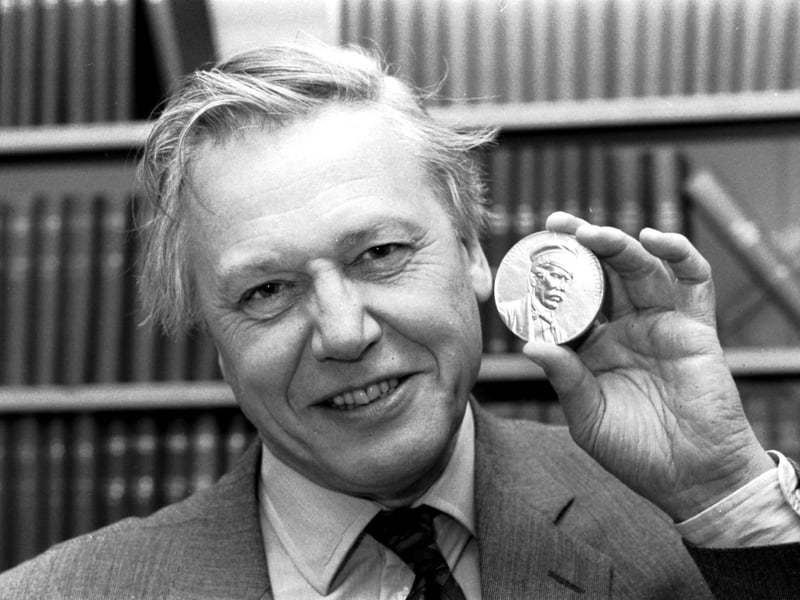 British journalist and broadcaster Sir David Attenborough with the Livingstone medal he received at a Royal Geographical Society lecture in Edinburgh, March 1990.