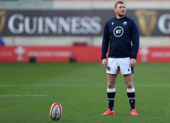 Scotland's fly-half Finn Russell warms up ahead of the 2020 Six Nations Championship rugby union match between Wales and Scotland at the Parc y Scarlets stadium in Llanelli, south Wales on October 31, 2020. (Photo by Geoff Caddick / POOL / AFP) / RESTRICTED TO EDITORIAL USE. Use in books subject to Welsh Rugby Union (WRU) approval. (Photo by GEOFF CADDICK/POOL/AFP via Getty Images)