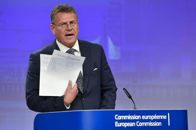 European Commissioner for Inter-institutional Relations and Foresight Maros Sefcovic holds up documents as he speaks during a media conference at EU headquarters in Brussels. Picture: AP Photo/Geert Vanden Wijngaert