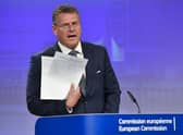 European Commissioner for Inter-institutional Relations and Foresight Maros Sefcovic holds up documents as he speaks during a media conference at EU headquarters in Brussels. Picture: AP Photo/Geert Vanden Wijngaert