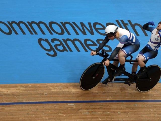 Scotland's Neil Fachie celebrates with pilot Lewis Stewart after winning the men's para-sport 1000m B time trial tandem final on day one of the Commonwealth Games.
