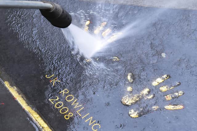 JK Rowling's handprints outside the City Chambers are cleaned after they were covered with red paint (Picture: Lisa Ferguson)