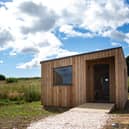 The self-catering cabins are situated a short walk away from the main venue and, as part of plans to rewild the farm in which the facility is located, the cabins will eventually be situated in a native wildflower meadow.