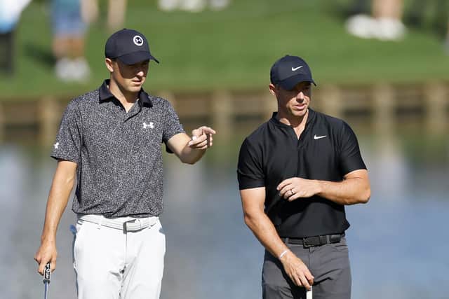 Jordan Spieth and Rory McIlroy chat on the 16th green before later becoming embroiled in a heated disucssion during the first round of The Players Championship on the Stadium Course at TPC Sawgrass in Ponte Vedra Beach, Florida. Picture: Mike Ehrmann/Getty Images.