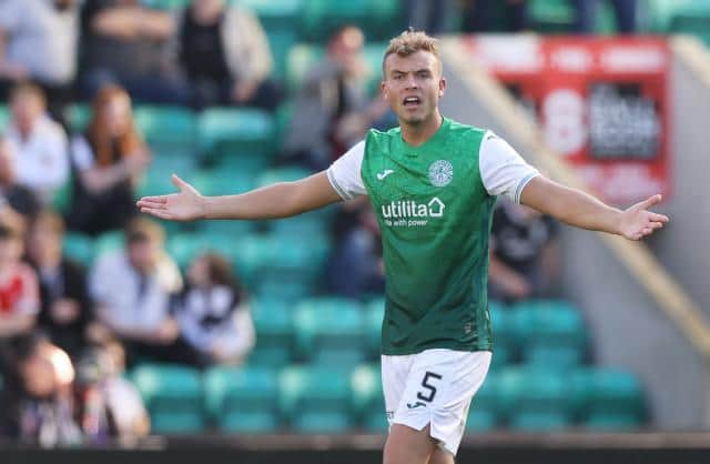 Hibernian defender Ryan Porteous was shown a straight red card by referee Nick Walsh for a challenge on Rangers midfielder Joe Aribo. (Photo by Craig Williamson / SNS Group)