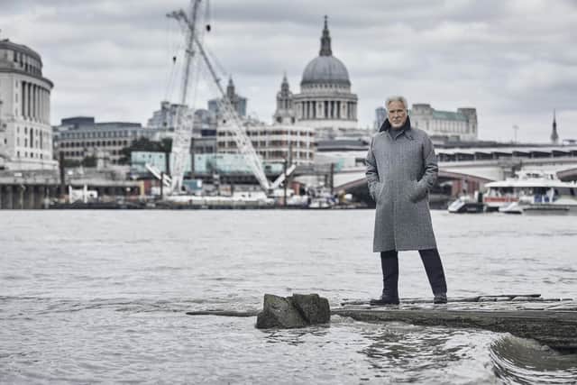 Tom Jones stands by the River Thames in London with St Paul's Cathedral in the background