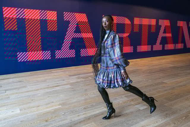 Model Eunice Olumide wears a tartan designed by Charles Jeffery during a preview for the forthcoming Tartan exhibition at V&A Dundee. Picture: Jane Barlow/PA Wire