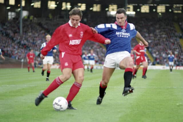 Ian Ferguson (right) attempts to get to grips with Aberdeen forward Eoin Jess in the 1992 League Cup final.