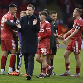 Rangers manager Michael Beale applauds the fans after the defeat by Aberdeen at Pittodrie.