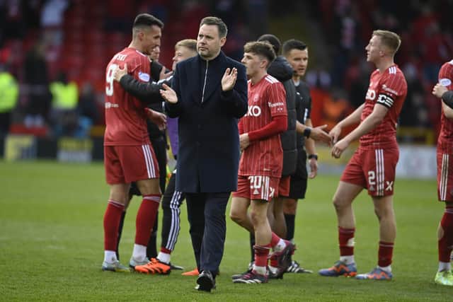 Rangers manager Michael Beale applauds the fans after the defeat by Aberdeen at Pittodrie.