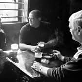 Longannet Colliery, three generations of miners. George Lang (centre), grandfather Jock Land (left) and father Bert Lang (right) have been miners all their lives. They are pictured having a beer in the Mansfield Arms, Sauchie, Scotland, April 2001.  © Jeremy Sutton-Hibbert/ Courtesy of University of St Andrews.