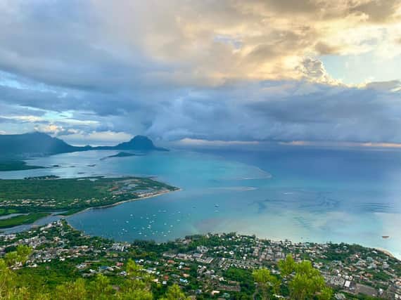The roof-top bar at the Veranda Tamarin Hotel offers views of the sunset on the island’s west coast. Pic. PA Photo/Elodie Lagourgue.