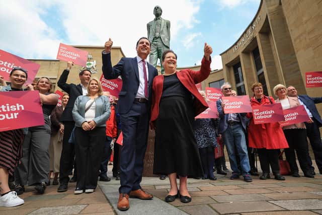 Scottish Labour leader Anas Sarwar and his deputy Jackie Ballie pose with activists after he delivered a speech on Scottish Labour’s plans to renew and reset devolution (Photo by Jeff J Mitchell/Getty Images)