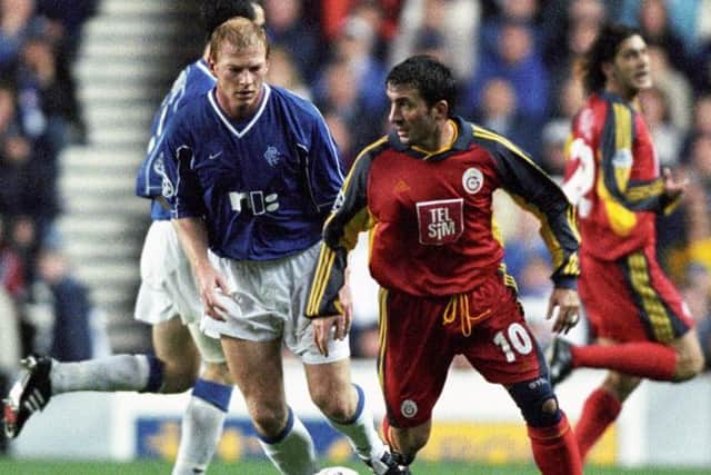 Gheorghe Hagi (right) is kept in check by Rangers midfielder Jorg Albertz when the sides last met at Ibrox in 2000.