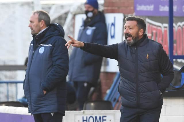 Derek McInnes' Kilmarnock tenure began with a 2-0 win over Queen of the South.