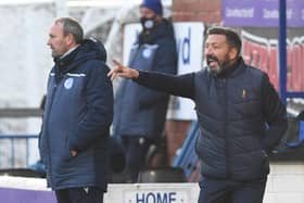 Derek McInnes' Kilmarnock tenure began with a 2-0 win over Queen of the South.