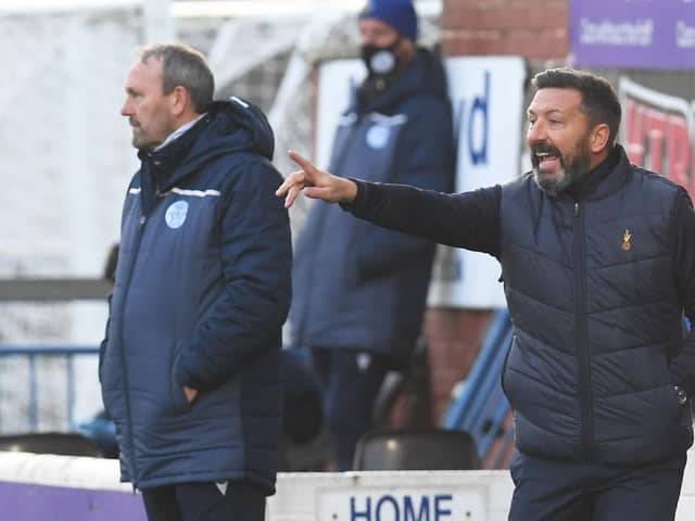 Derek McInnes' Kilmarnock tenure began with a 2-0 win over Queen of the South.