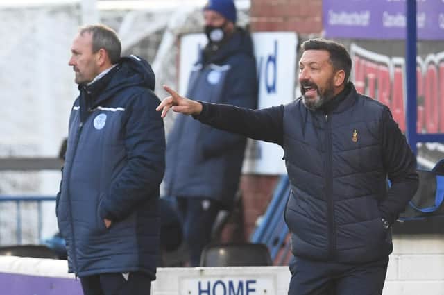 Derek McInnes' Kilmarnock tenure began with a 2-0 win over Queen of the South.