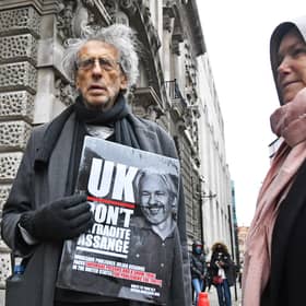 Piers Corbyn (left) outside the Old Bailey, London, ahead of a judgement in the Julian Assange extradition case. Wikileaks founder Assange, 49, faces an 18-count indictment, alleging a plot to hack computers and a conspiracy to obtain and disclose national defence information.
