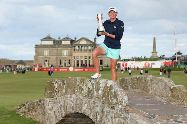 Stacy Lewis of the United States poses with the trophy on the Swilcan Bridge following her victory in the 2013 Ricoh Women's British Open at the Old Course in St Andrews. Picture: Warren Little/Getty Images.