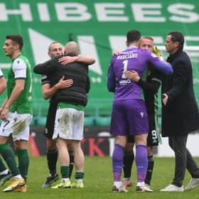 Celtic's Scott Brown with Hibs Alex Gogic, and Celtic's Leigh Griffiths with Hibs Ofir Marciano at full time.