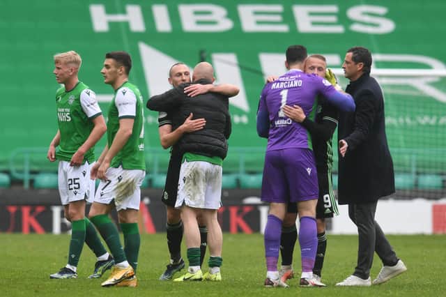 Celtic's Scott Brown with Hibs Alex Gogic, and Celtic's Leigh Griffiths with Hibs Ofir Marciano at full time.