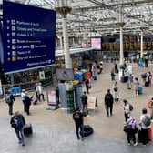 Commuters and travellers at Edinburgh's Waverley Station.