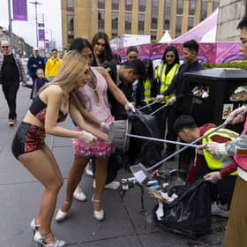 Cast and crew from The Ladyboys of Bangkok have been clearing rubbish up outside their venue on Lothian Road. Picture: Duncan McGlynn