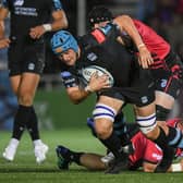 Glasgow Warriors' Scott Cummings is tackled by Cardiff's Seb Davies during a United Rugby Championship match between the two teams.