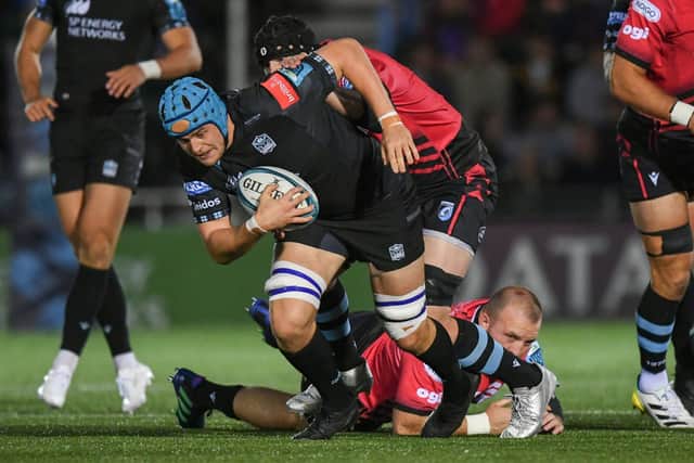 Glasgow Warriors' Scott Cummings is tackled by Cardiff's Seb Davies during a United Rugby Championship match between the two teams.