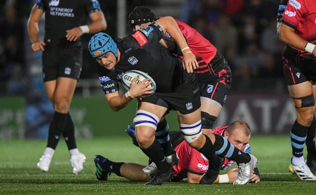 Glasgow Warriors' Scott Cummings is tackled by Cardiff's Seb Davies during a United Rugby Championship match between the two teams.