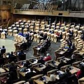 MSPs have been ticked off for not social distancing at Holyrood