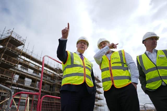 First Minister John Swinney visits a housing development earlier this year (Picture: Peter Summers/Getty Images)